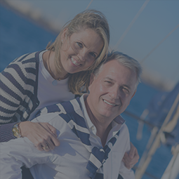 couple smiling by the water